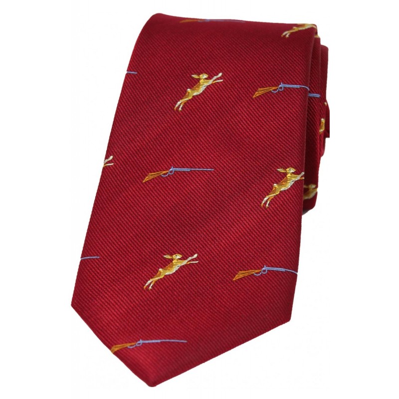 Silk hunting tie in red with hare and shotgun motif.